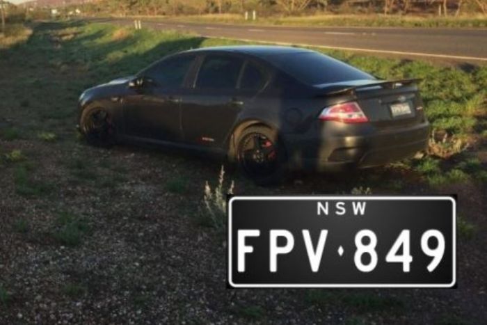 a photo of the black car and the number plate