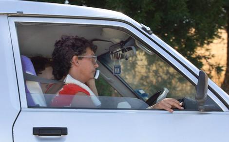 Mandy Martyn stops to make a phone call yesterday on a side road off the Myrtleford-Yackandandah road.